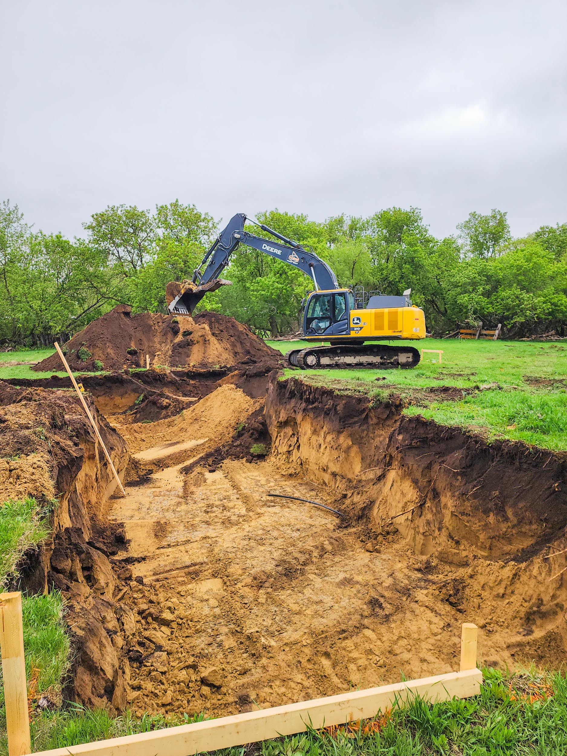 Excavator preparing the site for a new home foundation