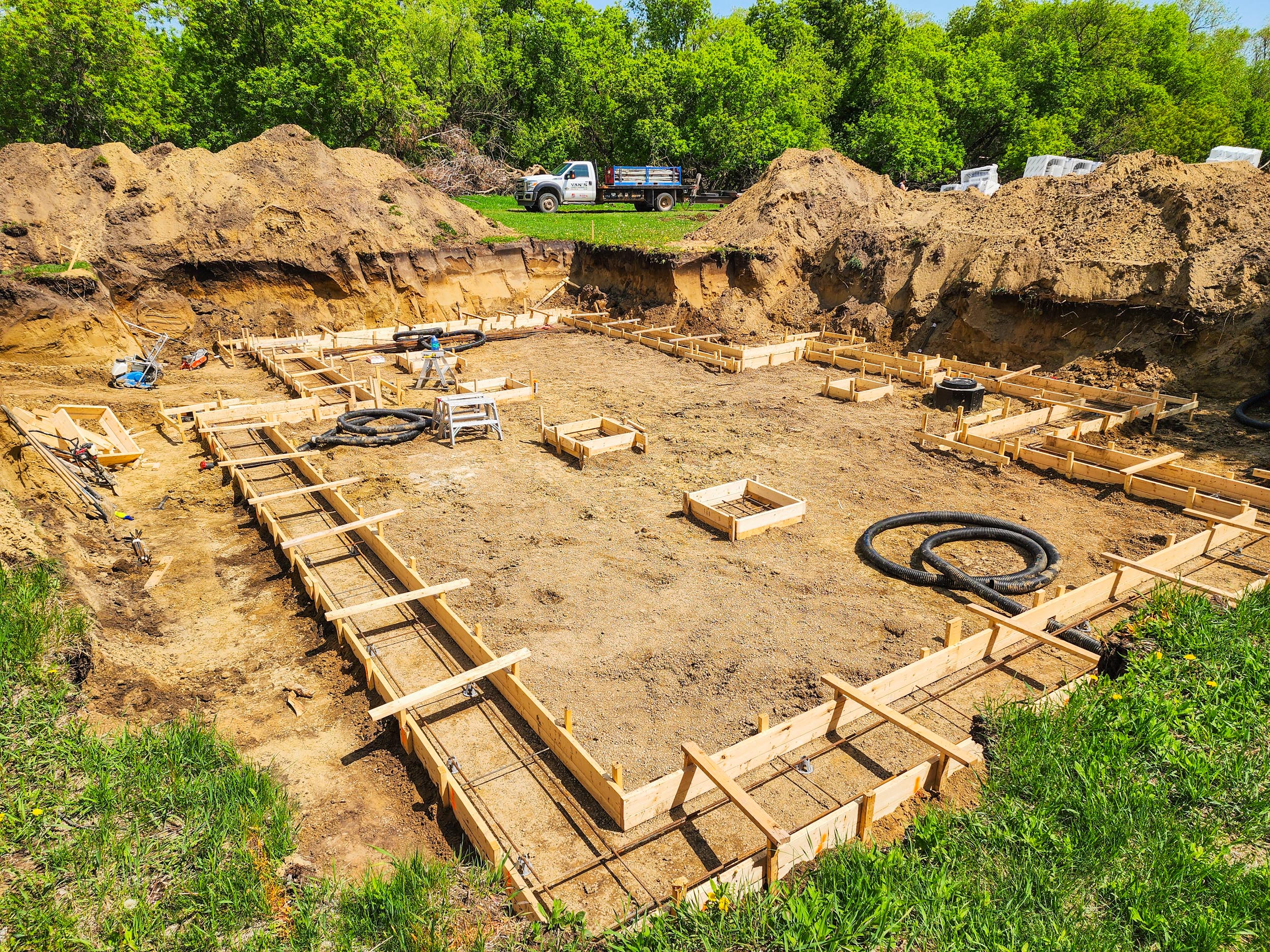 Concrete footing forms prepared for an ICF foundation