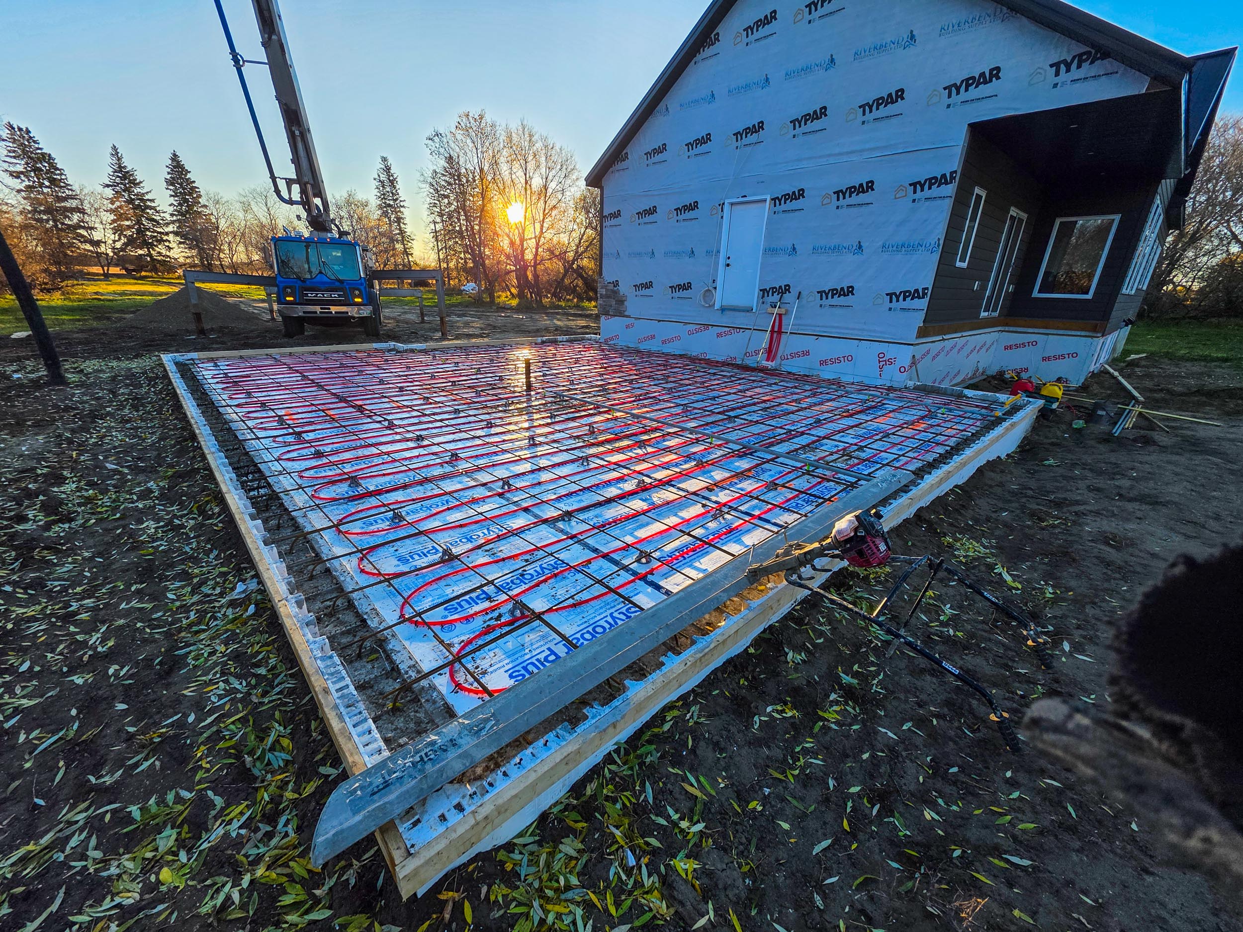 In-floor heating lines and reinforcement for a garage slab