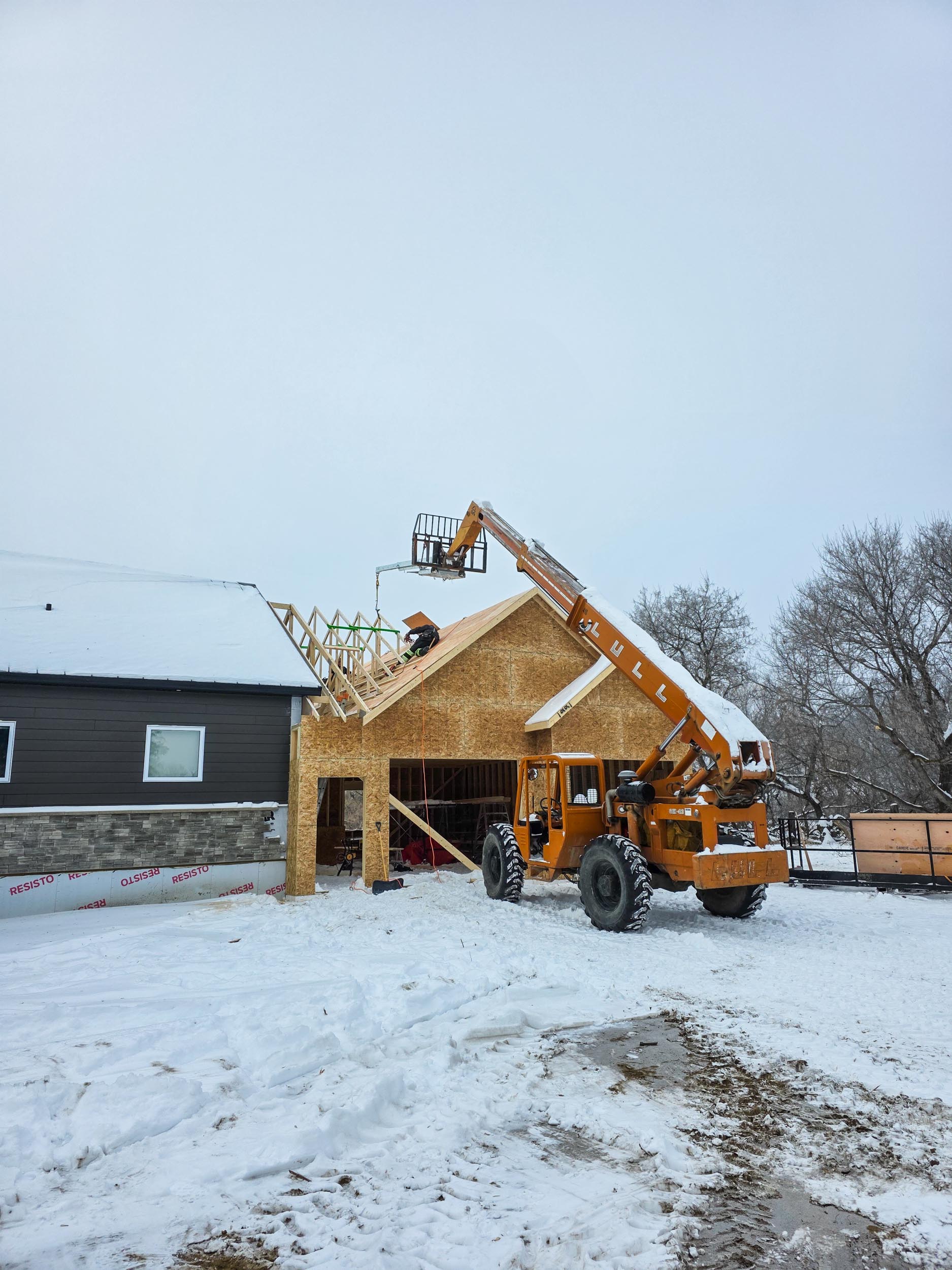 Garage addition roof being tied into an existing home