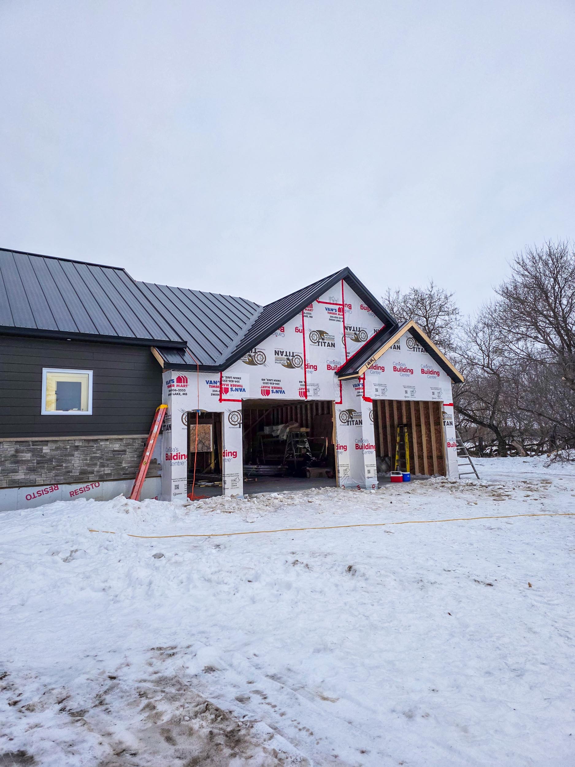 Metal roof valleys on an attached garage addition