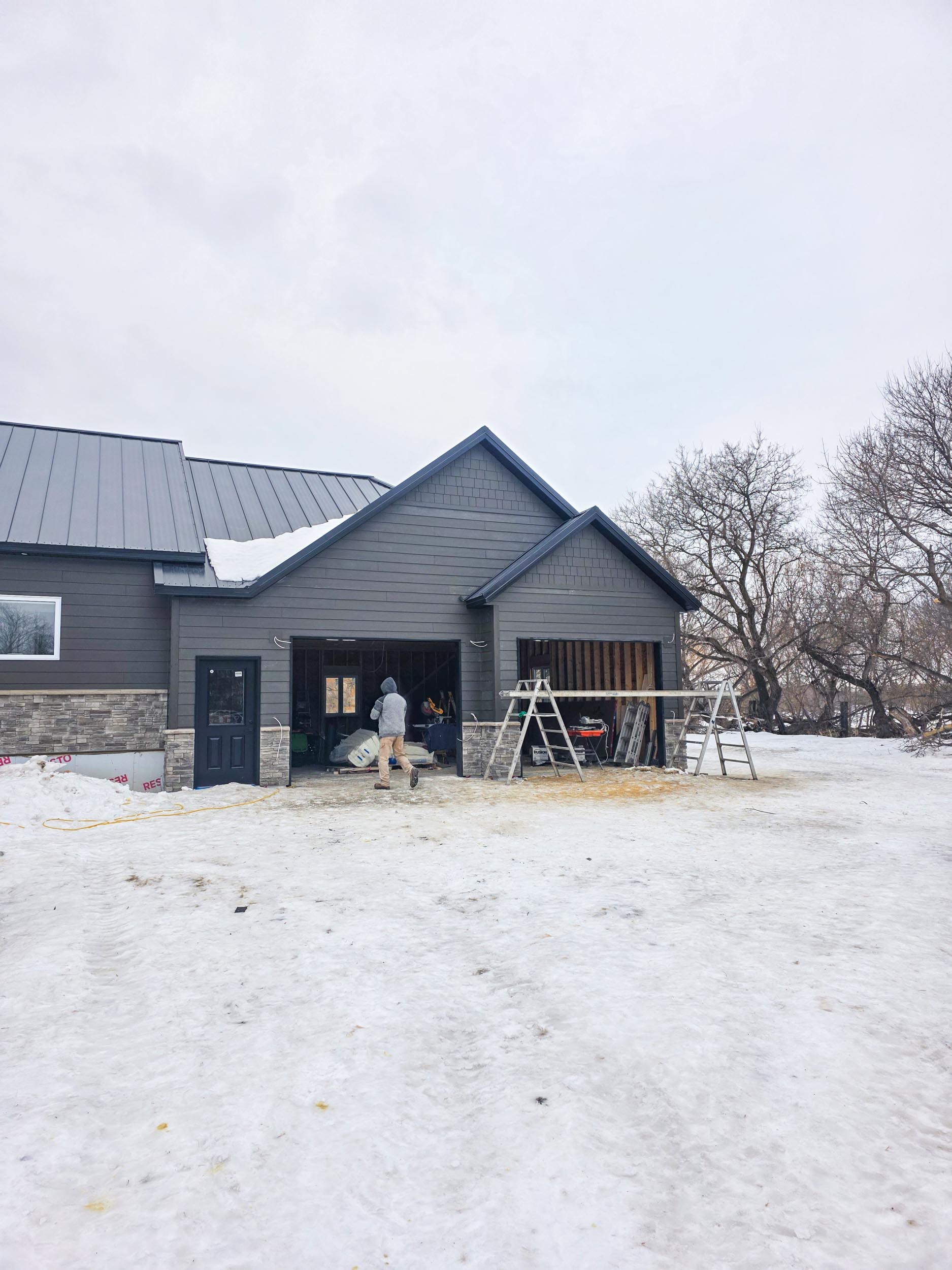 Completed exterior of a two-bay garage addition