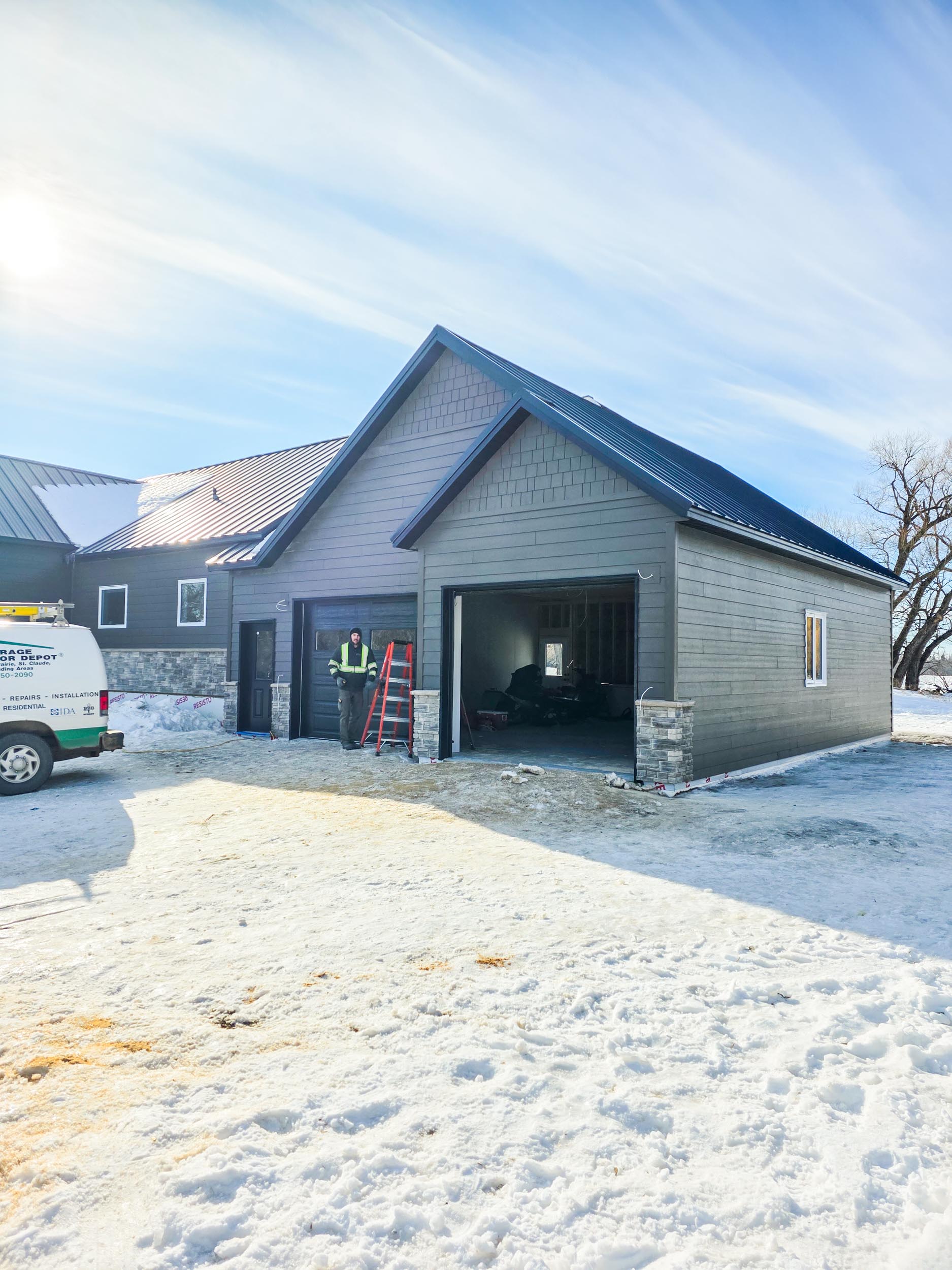 Completed two-bay garage addition near Notre-Dame-de-Lourdes, Manitoba
