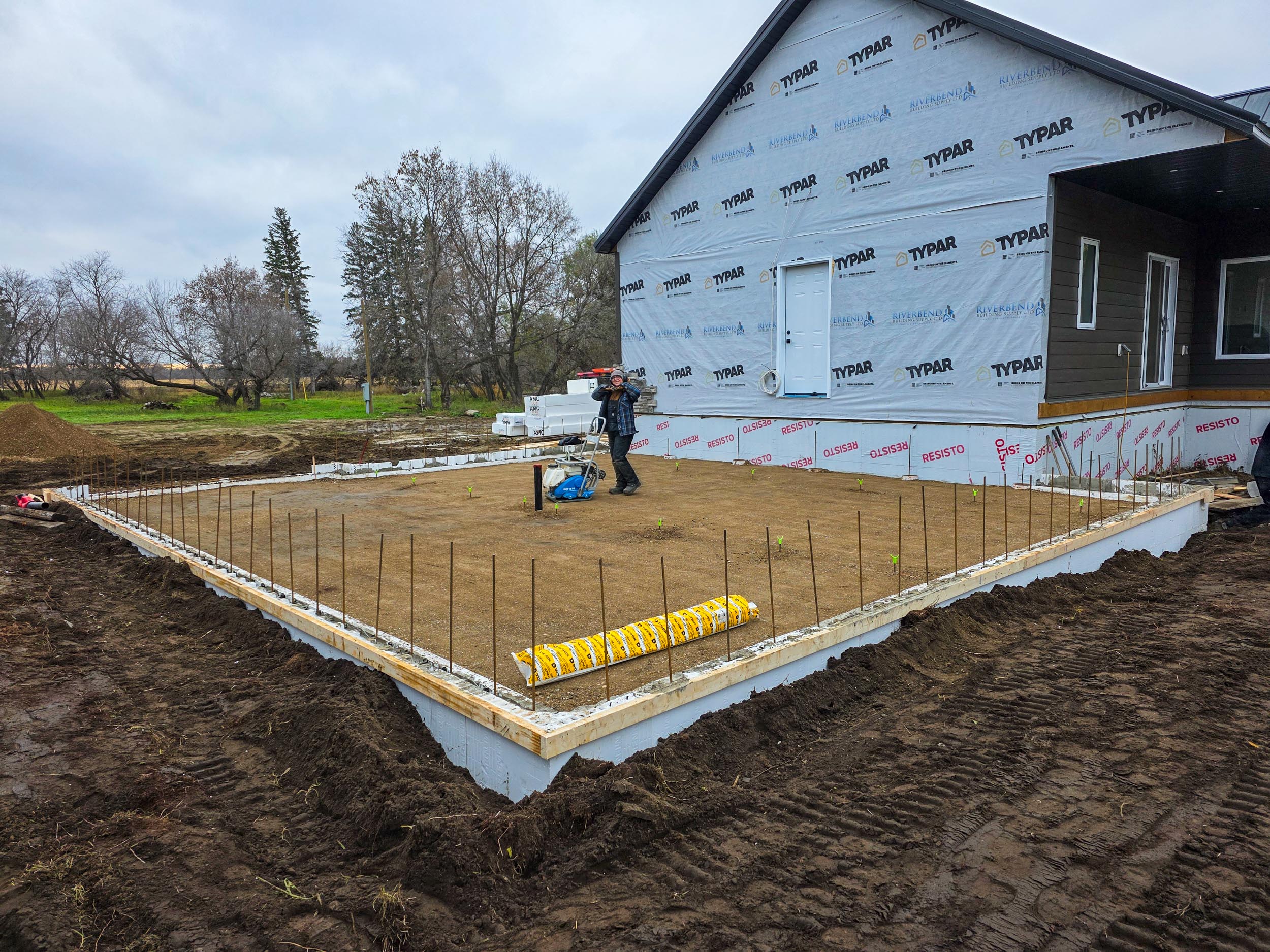 Compacted base inside a garage addition foundation
