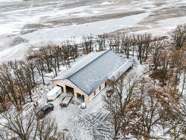 House shell construction with framing, roof, windows and exterior envelope completed by Grey Owl Construction near St. Léon, Manitoba.